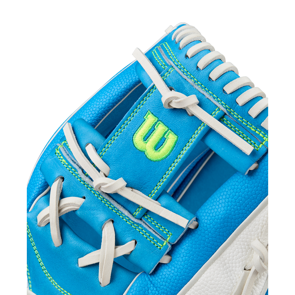 Close-up of the Wilson A2000 H12SS 12" Fastpitch Glove, featuring blue and white design, white laces, bright green stitching, and a bold green “W” logo on the wrist strap. Model: WBW10348612.