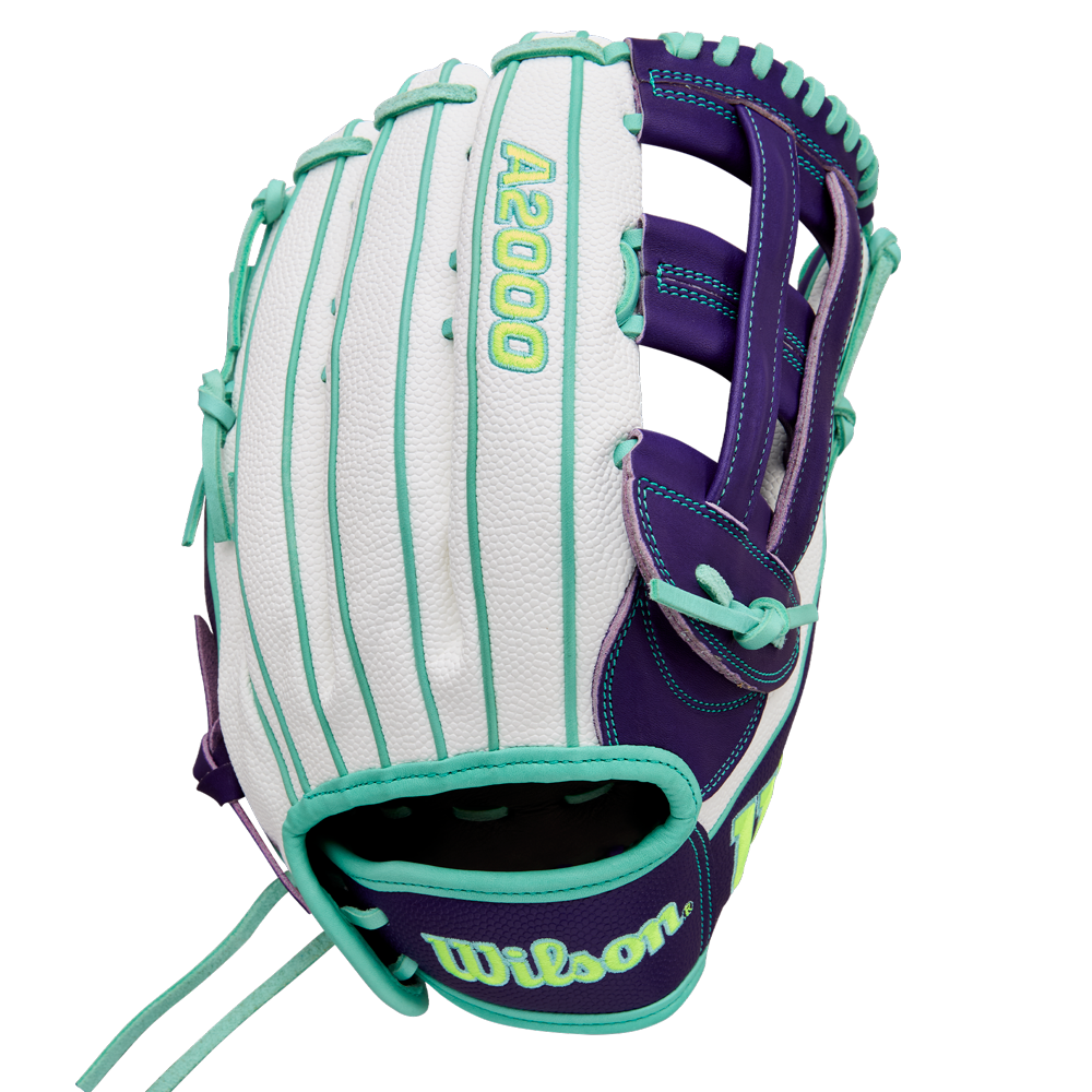 The Wilson A2000 FP50SS 12.25" Fastpitch Glove (WBW1034891225) features a white, teal, and purple design with teal laces, Pro Stock leather, open webbing, and an embroidered Wilson logo on the wrist strap.