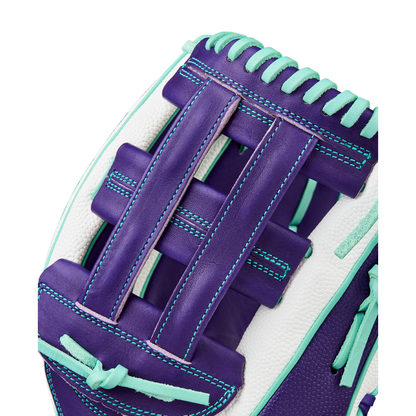 Close-up of the Wilson A2000 FP50SS 12.25" Fastpitch Glove, crafted with Pro Stock leather, SuperSkin backing, H-web pattern, and purple with teal and white accents; detailed stitching shown against a white background.