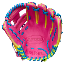 The Wilson A2000 1786SS 11.5" Baseball Glove (WBW103492115) features a bright pink design with yellow accents, blue laces, SuperSkin material, and visible palm, stitching, and brand label.