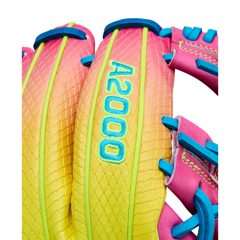 Close-up of the Wilson A2000 1786SS 11.5" Baseball Glove (WBW103492115) featuring a yellow, orange, and pink gradient design, blue stitching, SuperSkin backing, and "A2000" embroidered in blue with a green outline.