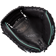 The Wilson A2000 AW28 34" Austin Wells Gameday Catcher's Mitt (FALL 2025: WBW10349434) by Wilson features a black design with teal accents and visible laces, shown open with the palm and pocket facing up—just like Austin Wells uses.