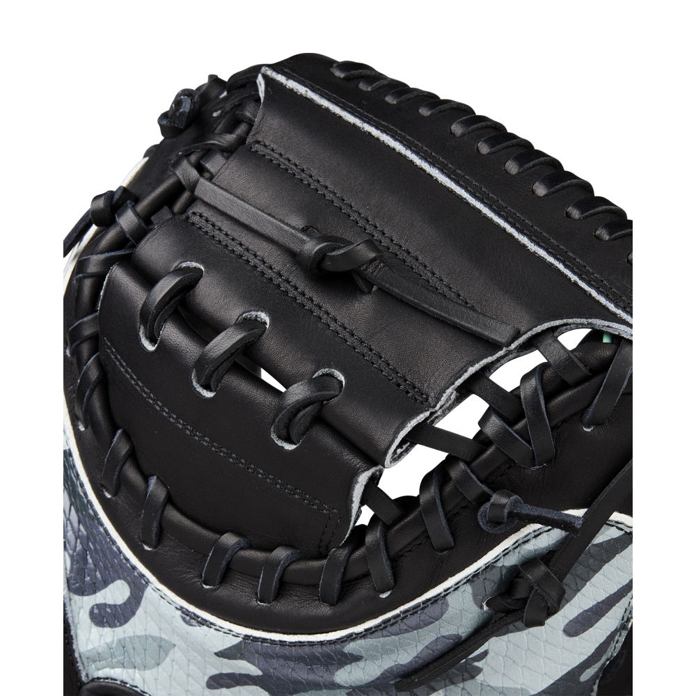 Close-up of the Wilson A2000 AW28 34" Austin Wells Gameday Catcher's Mitt (WBW10349434), featuring black leather, black laces, and a camouflage lower design, shown against a white background.