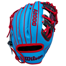The Wilson A2000 PF11SS 11" Baseball Glove (WBW10394011) features a blue design with red lacing, black accents, bold stitching, and Pro Stock leather, shown against a plain light background.
