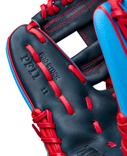 Close-up of the Wilson A2000 PF11SS 11" Baseball Glove (WBW10394011), a dark blue infield glove with bright red laces and stitching, light blue accents, and “PF11 11” and “PRO STOCK” embossing. Made from Pro Stock leather.