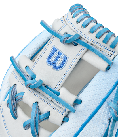 Close-up of the Wilson A2000 H12SS 12" Fastpitch Glove (WBW10394612) in white, with light blue laces and trim, a textured pattern, and an embroidered blue W logo on a Pro Stock leather patch.