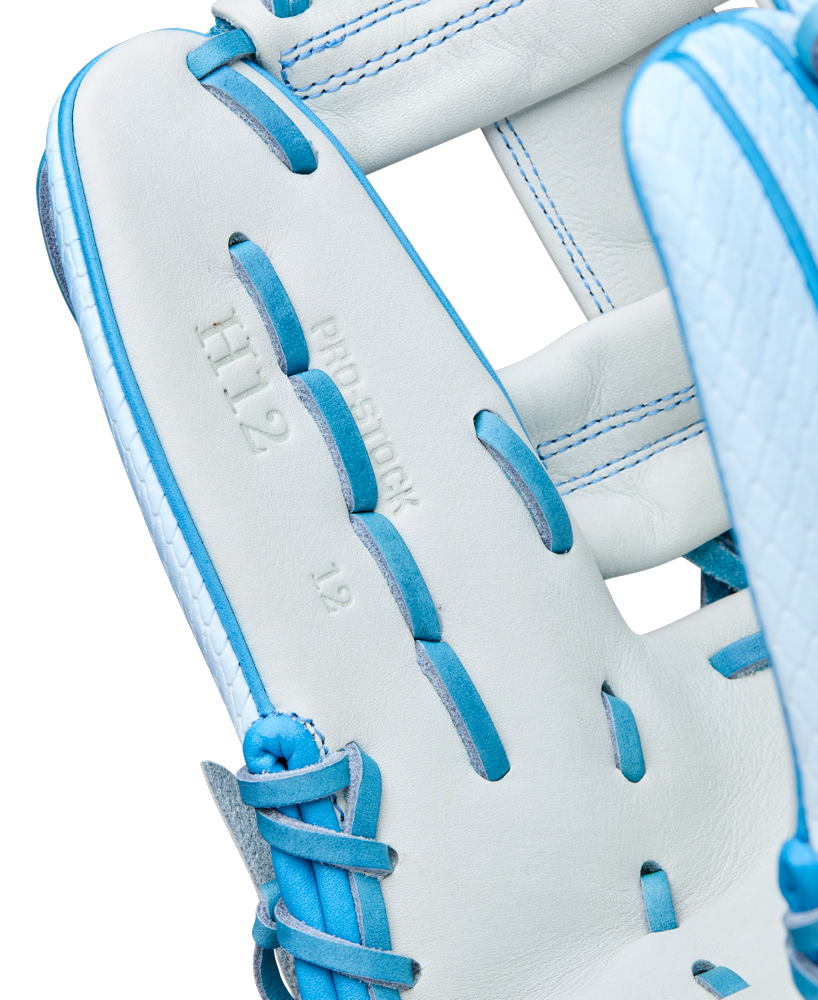 Close-up of the Wilson A2000 H12SS 12" Fastpitch Glove (WBW10394612) in white with blue laces, showcasing Pro Stock leather, embossed “H12,” “PRO STOCK,” and “12,” and Wilson’s expert craftsmanship.