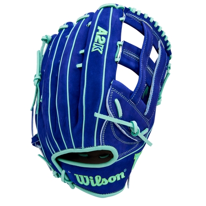 The Wilson A2K JS22 12.75" Juan Soto GM Baseball Glove (WBW1039531275) features royal blue Pro Stock Select leather, teal laces and accents, white stitching, and an embroidered Wilson logo on the wrist strap for top-tier durability and feel.