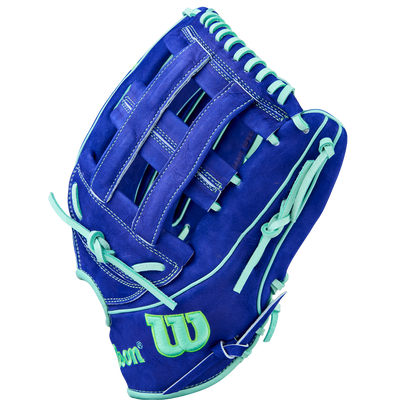 The Wilson A2K JS22 12.75" Juan Soto GM Baseball Glove features royal blue Pro Stock Select leather, light teal laces and accents, plus a green Wilson logo outlined in teal on the wrist.