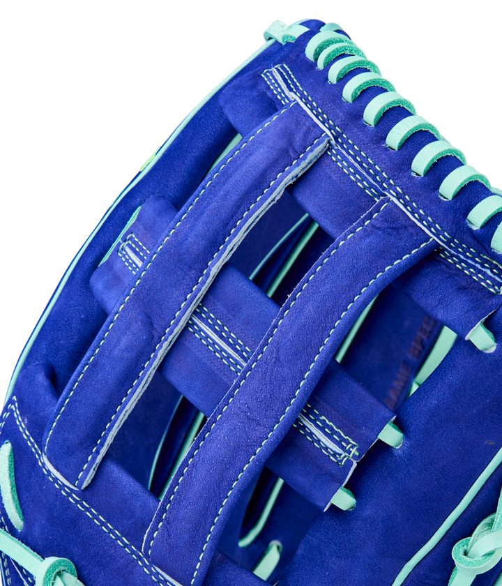 Close-up of the Wilson A2K JS22 12.75" Juan Soto GM Baseball Glove, featuring blue Pro Stock Select leather, light blue laces and stitching, woven webbing, and inspired by Juan Soto’s iconic glove.