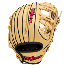 The Wilson A1000 PF11 11" Baseball Glove (WBW10395511) by Wilson is tan with black lacing, red logos, and visible stitching. Designed with Pedroia Fit for younger players, it features an open web and is shown on a white background.