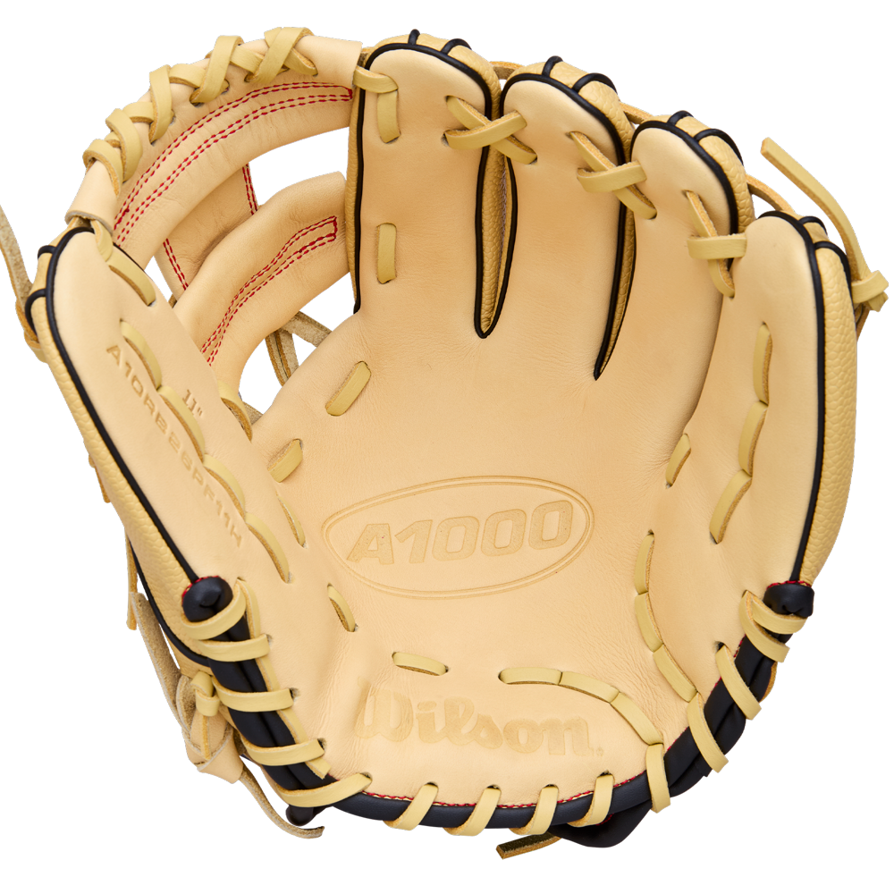 The Wilson A1000 PF11 11" Baseball Glove (WBW10395511) is a tan infield glove with black lacing, red stitching, Pedroia Fit for a snug feel, and brand logos plus model info on the leather.