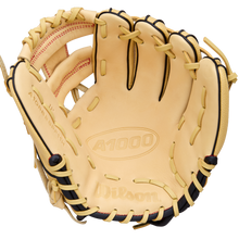 The Wilson A1000 PF11 11" Baseball Glove (WBW10395511) is a tan infield glove with black lacing, red stitching, Pedroia Fit for a snug feel, and brand logos plus model info on the leather.