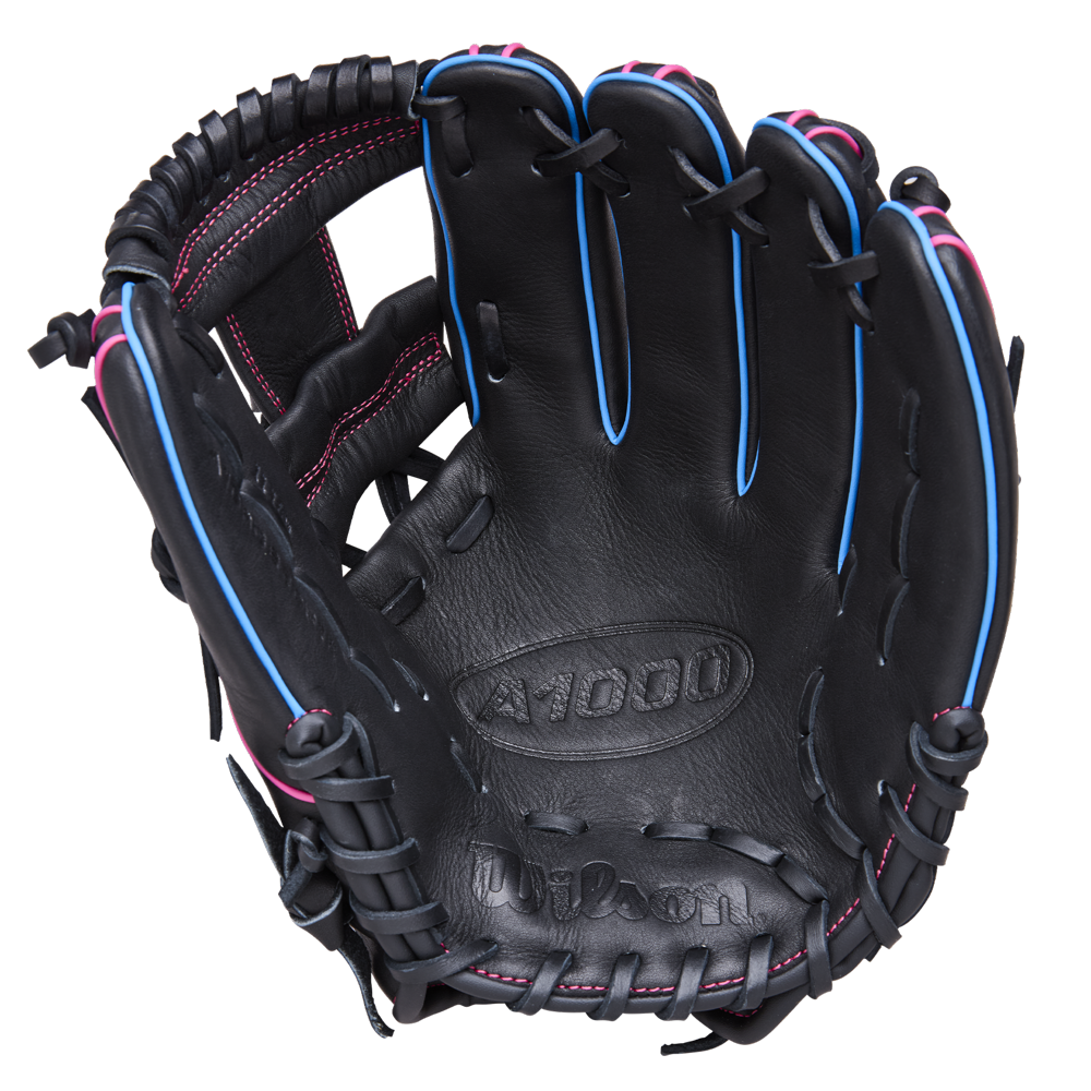 The Wilson A1000 DP15 11.5" Baseball Glove (WBW103956115) features a black design with pink stitching, blue trim, visible laces, and palm branding. Made from full grain leather for lasting performance.