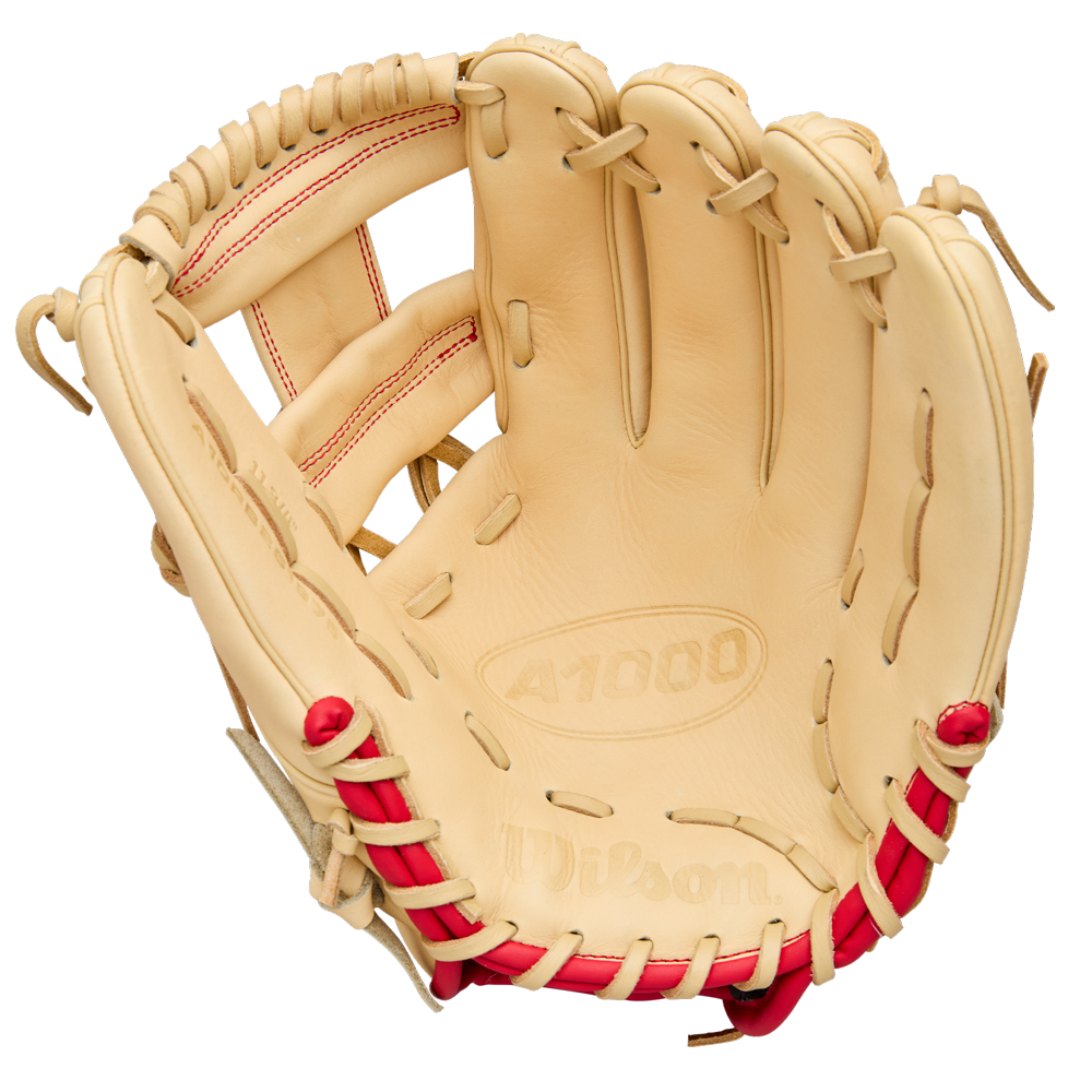 A tan Wilson A1000 1975 11.75" youth infield glove with red stitching and laces is shown open, displaying the pocket and finger slots. The palm is embossed with Wilson and A1000. Model: WBW1039591175.