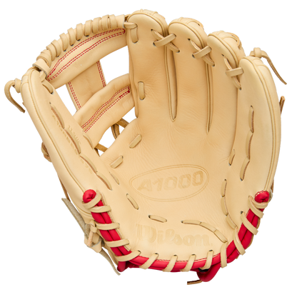 A tan Wilson A1000 1975 11.75" youth infield glove with red stitching and laces is shown open, displaying the pocket and finger slots. The palm is embossed with Wilson and A1000. Model: WBW1039591175.