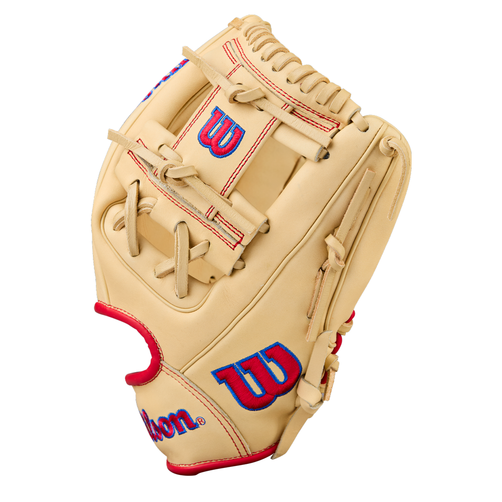 The Wilson A1000 1975 11.75" Baseball Glove (WBW1039591175) features a tan design with red laces and blue-and-red Wilson logos on the thumb and wrist, displayed against a plain white background.