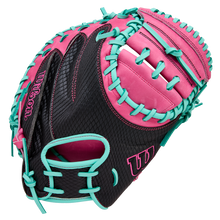 The Wilson A1000 CM33 33" Baseball Catcher's Mitt (WBW10396633) features full grain black leather with pink accents, bright turquoise lacing, and the Wilson logo on the thumb and pinky.