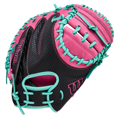 The Wilson A1000 CM33 33" Baseball Catcher's Mitt (WBW10396633) features full grain black leather with pink accents, bright turquoise lacing, and the Wilson logo on the thumb and pinky.