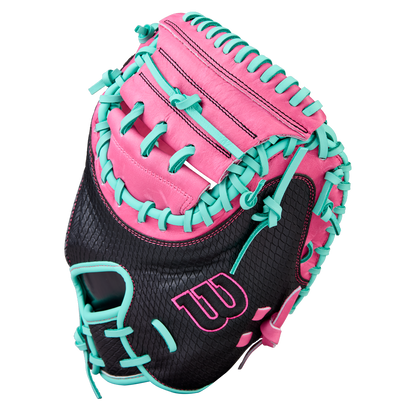 The Wilson A1000 CM33 33" Baseball Catcher's Mitt (WBW10396633) by Wilson features black full grain leather, pink accents, teal laces, and a large W logo—perfect as a stylish youth catcher’s mitt, shown against a white background.