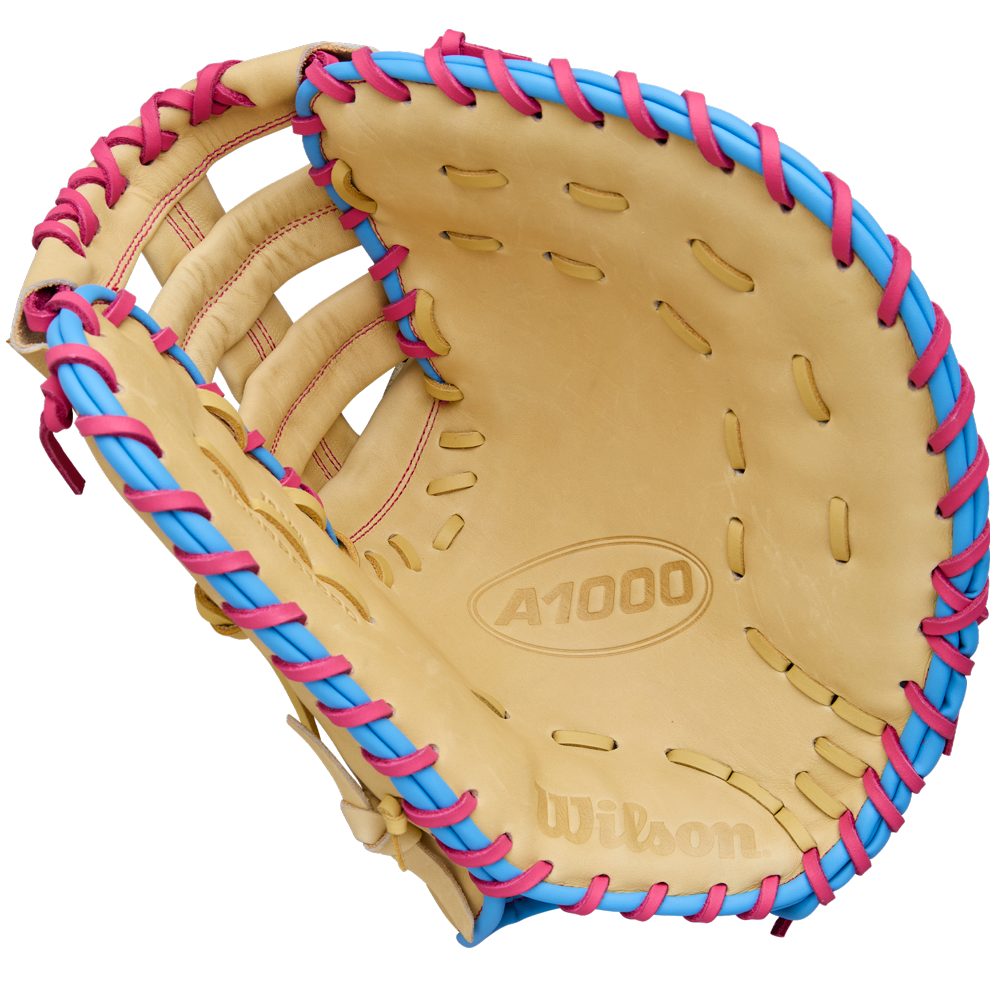 A Wilson A1000 1620 12.5" Baseball First Base Mitt (WBW103967125) by Wilson, shown open with palm and webbing visible against a white background, features full grain leather and blue and pink laces.