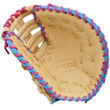 A Wilson A1000 1620 12.5" Baseball First Base Mitt (WBW103967125) by Wilson, shown open with palm and webbing visible against a white background, features full grain leather and blue and pink laces.