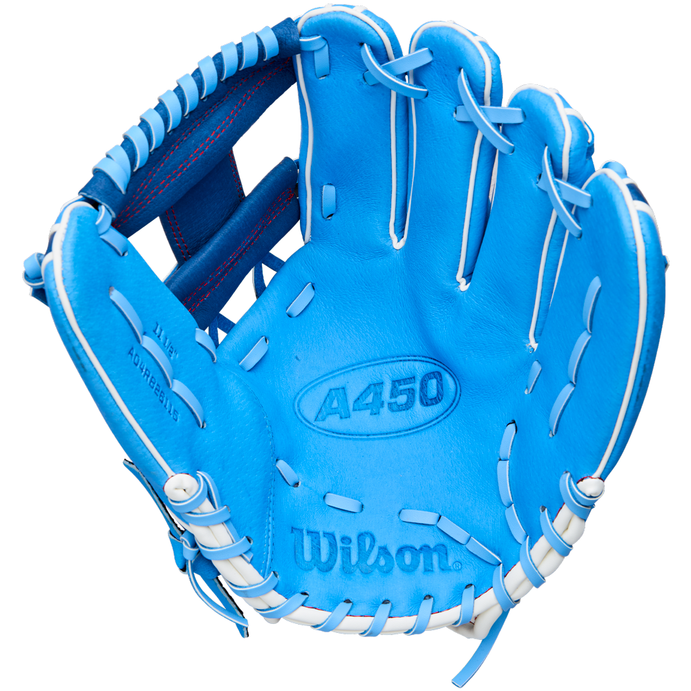 A Wilson A450 11.5″ Youth Baseball Glove (WBW103981115) in bright blue with white laces, shown open with the palm facing up. Made from top grain leather, this Wilson glove features detailed stitching, a Quick Fit Wrist for adjustable comfort, and prominent Wilson branding on the interior.
