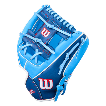 The Wilson A450 11.5″ Youth Baseball Glove (WBW103981115) is shown on a white background, featuring a blue and light blue color scheme with red and white Wilson logo accents, blue laces, and white stitching. Crafted from top grain leather, this glove includes a Quick Fit Wrist system to ensure a secure and comfortable fit for young players.