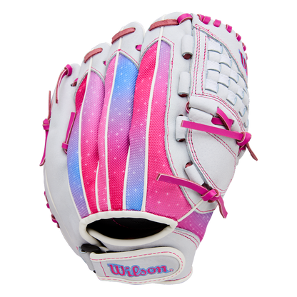 The Wilson Flash 11.5" Fastpitch Glove (WBW103985115) features a white design with pink, purple, and blue accents, pink laces, Wilson embroidered on the wrist strap, a woven web, and a gradient color pattern on the back.