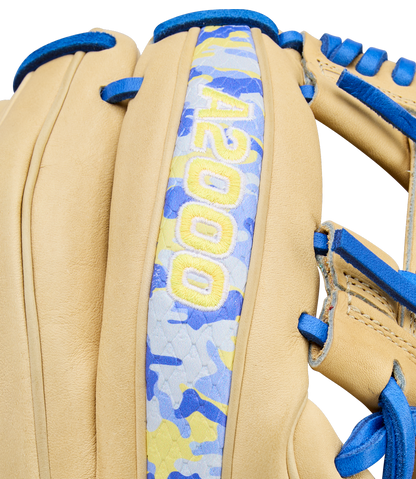 Close-up of the Wilson A2000 BWJ7 11.75" Bobby Witt Jr. GM Baseball Glove (WBW1040681175), featuring tan Pro Stock leather, blue laces, a blue/yellow/gray camo strip, and yellow “A2000” embroidery for infielders.