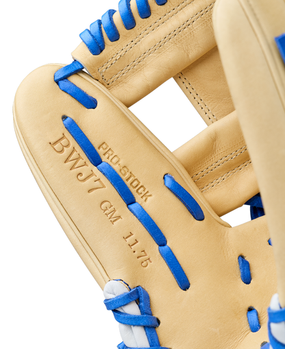 Close-up of the Wilson A2000 BWJ7 11.75" Bobby Witt Jr. GM Baseball Glove (WBW1040681175) with blue laces, Pro Stock leather, and "BWJ7 GM 11.75" and "PRO STOCK" embossed, showcasing fine stitching and leather texture.