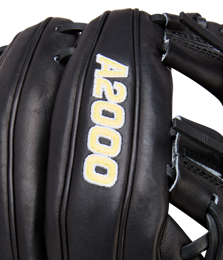 Close-up of a black Wilson A2000 1788 11.25" Baseball Glove (WBW1041051125) with white and gold A2000 embroidery. Made from Pro Stock Leather, the glove’s detailed stitching and texture are clearly visible.