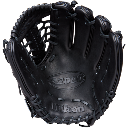 A black Wilson A2000 1789 11.5" baseball glove (WBW104106115) with visible stitching and lacing is photographed from above, showing the palm and webbing. The Wilson brand is embossed on premium Pro Stock leather.