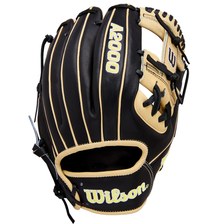 The Wilson A2000 1786 11.5" Baseball Glove: WBW104108115 features black and tan Pro Stock Leather, yellow stitching, and an H-Web design. The Wilson logo appears on the wrist strap against a white background.