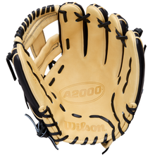 A Wilson A2000 1786 11.5" Baseball Glove (WBW104108115) in tan with black laces and H-Web construction is shown open, highlighting the inside palm area embossed with A2000 and Wilson in Pro Stock Leather.