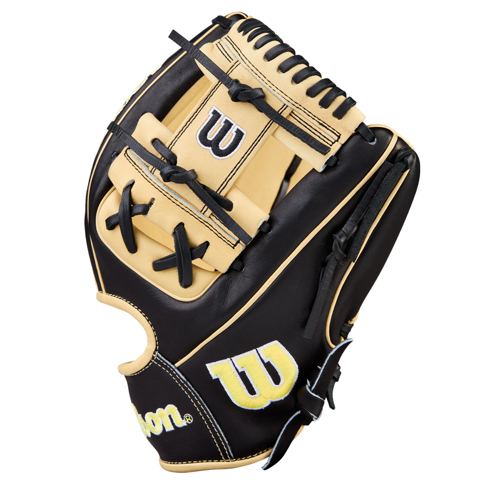 A Wilson A2000 1786 11.5" baseball glove, black and tan with black laces, H-Web design, and yellow-and-white Wilson W logos on thumb and wrist, displayed on a plain white background.