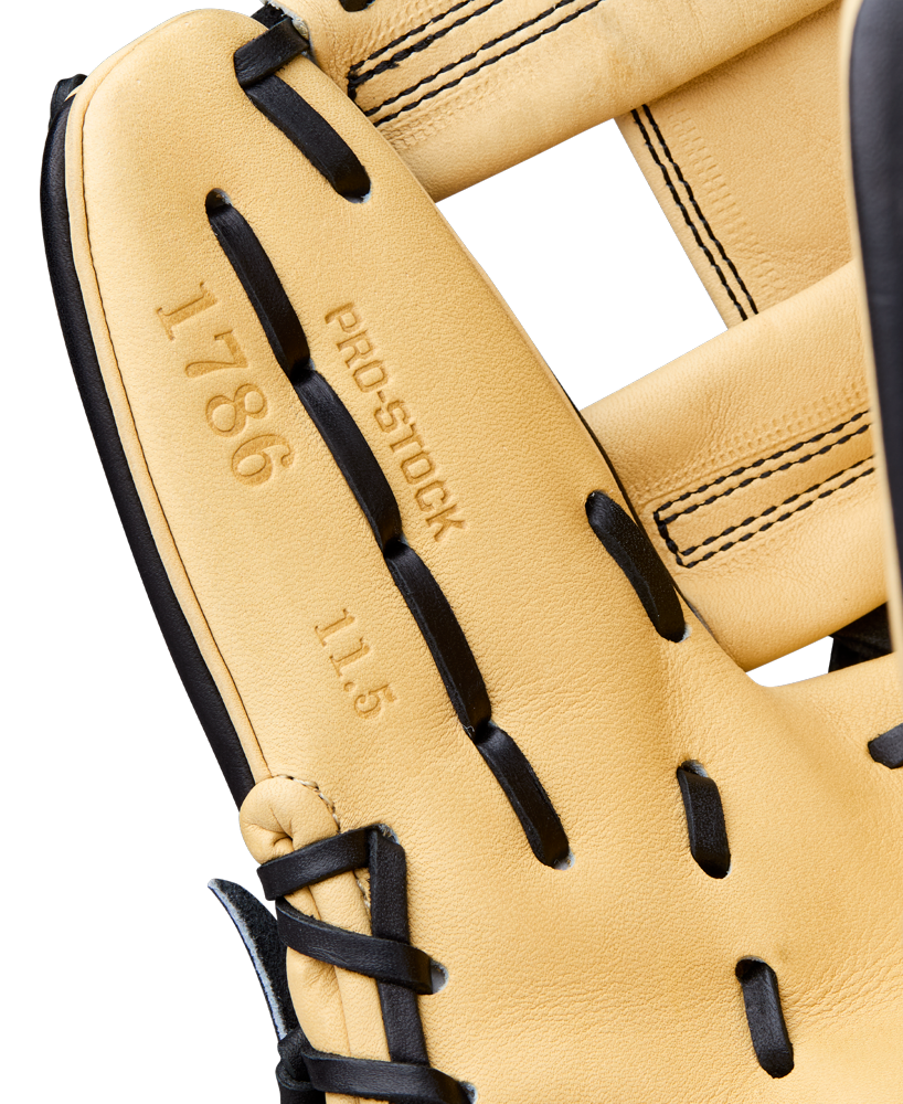 Close-up of a Wilson A2000 1786 11.5" Baseball Glove (WBW104108115), tan and black, with Pro Stock Leather, detailed stitching, and embossed text reading "1786," "PRO STOCK," and "11.5" inside.