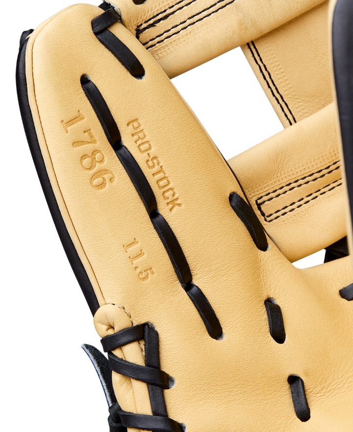 Close-up of a Wilson A2000 1786 11.5" Baseball Glove (WBW104108115), tan and black, with Pro Stock Leather, detailed stitching, and embossed text reading "1786," "PRO STOCK," and "11.5" inside.