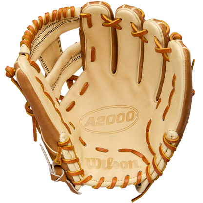 A Wilson A2000 1786 11.5" infield glove, crafted from Pro Stock Leather in tan and brown, is shown palm-side with visible stitching, laces, and an embossed Wilson logo inside.