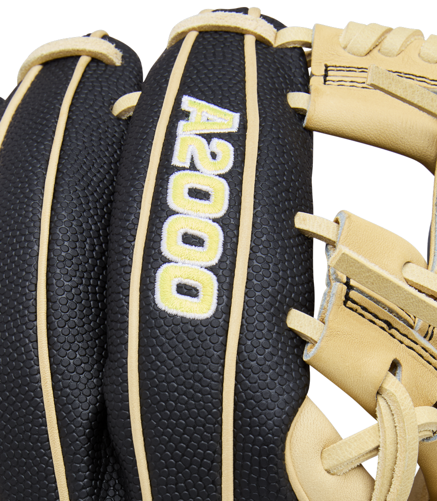 A close-up of a black and tan Wilson A2000 DP15SS 11.5" Baseball Glove (WBW104110115) with SuperSkin and "A2000" embroidered in white and yellow on the back.