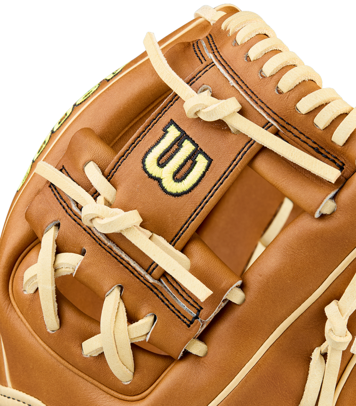 Close-up of the Wilson A2000 DP15 11.5" Baseball Glove, crafted from Pro Stock Leather with cream laces, detailed stitching, and a black-and-yellow Wilson logo on the back of the brown glove.