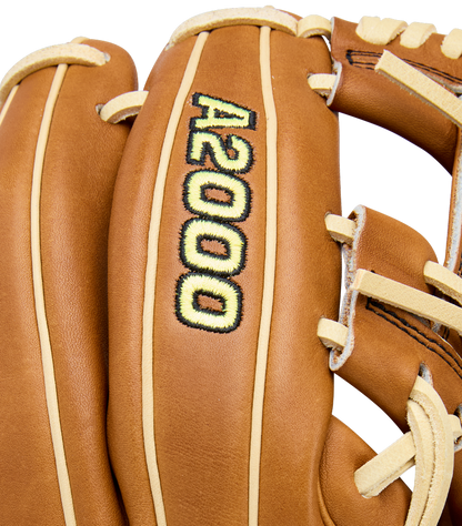 A close-up of a Wilson A2000 DP15 11.5" Baseball Glove (WBW104111115) with Pro Stock Leather, beige lacing, and black and yellow A2000 embroidery on the back.
