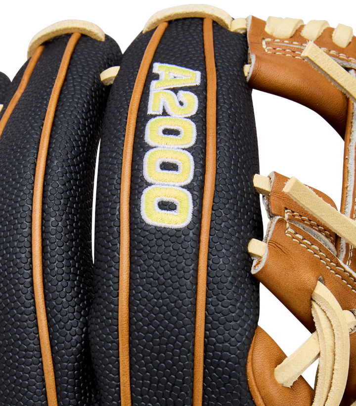 Close-up of a Wilson A2000 1975SS 11.75" Baseball Glove (WBW1041121175), featuring black and brown textured leather with yellow and white A2000 stitching on the finger. White background.