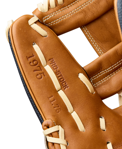 Close-up of a Wilson A2000 1975SS 11.75" Baseball Glove (WBW1041121175) with brown leather, light tan laces, and embossed details including "PRO STOCK," "11.75," and "1975" on the glove.