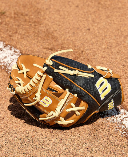 A Wilson A2000 1975SS 11.75" baseball glove (WBW1041121175), featuring brown and black leather with cream laces and a yellow-and-white W logo, rests on infield dirt near a white chalk line, showcasing SuperSkin durability.