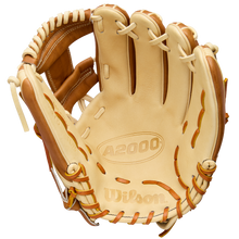 A tan and light brown Wilson A2000 1975 11.75" Baseball Glove (WBW1041131175) is shown open, featuring visible stitching, Pro Stock Leather construction, and embossed Wilson logos on the palm.