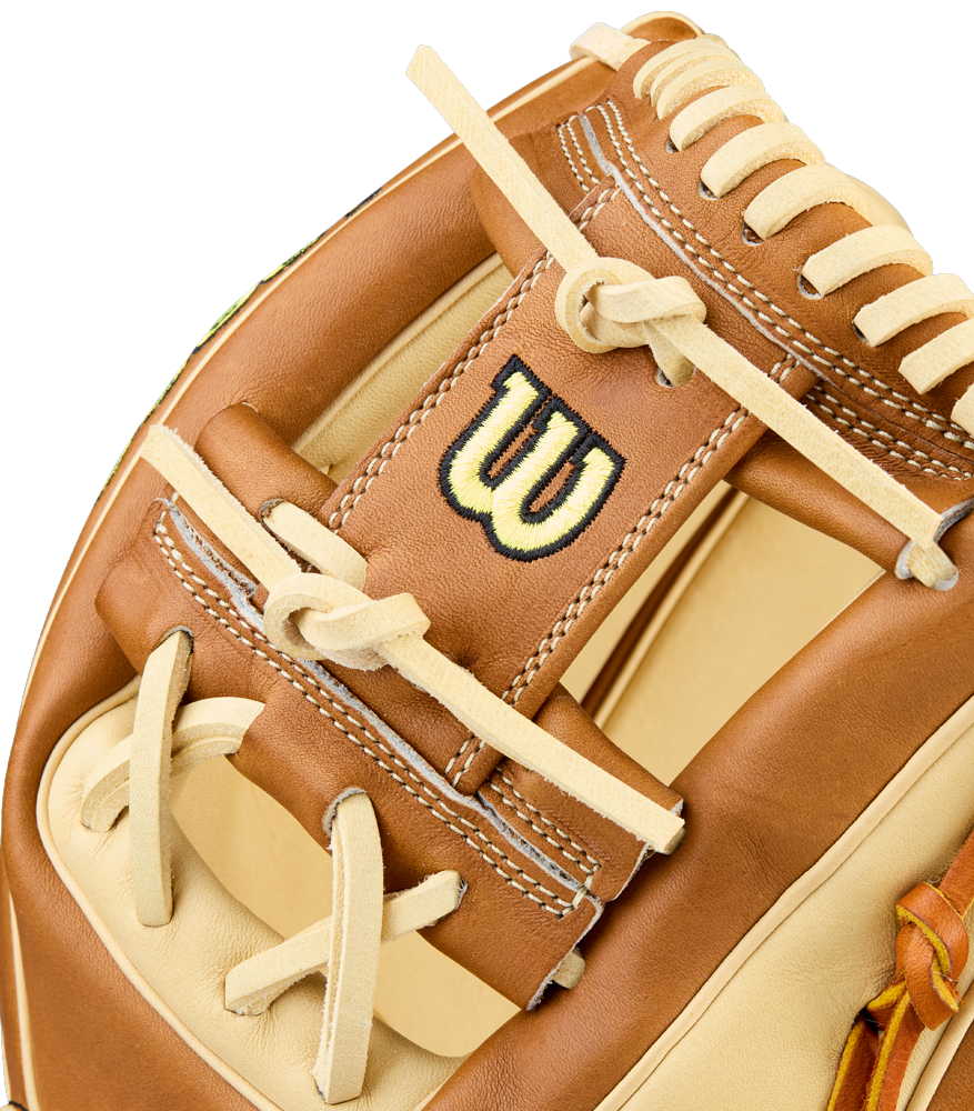 A close-up of the Wilson A2000 1975 11.75" Baseball Glove (WBW1041131175) highlights its tan and brown Pro Stock Leather, intricate stitching, laces, and the signature embroidered W logo.