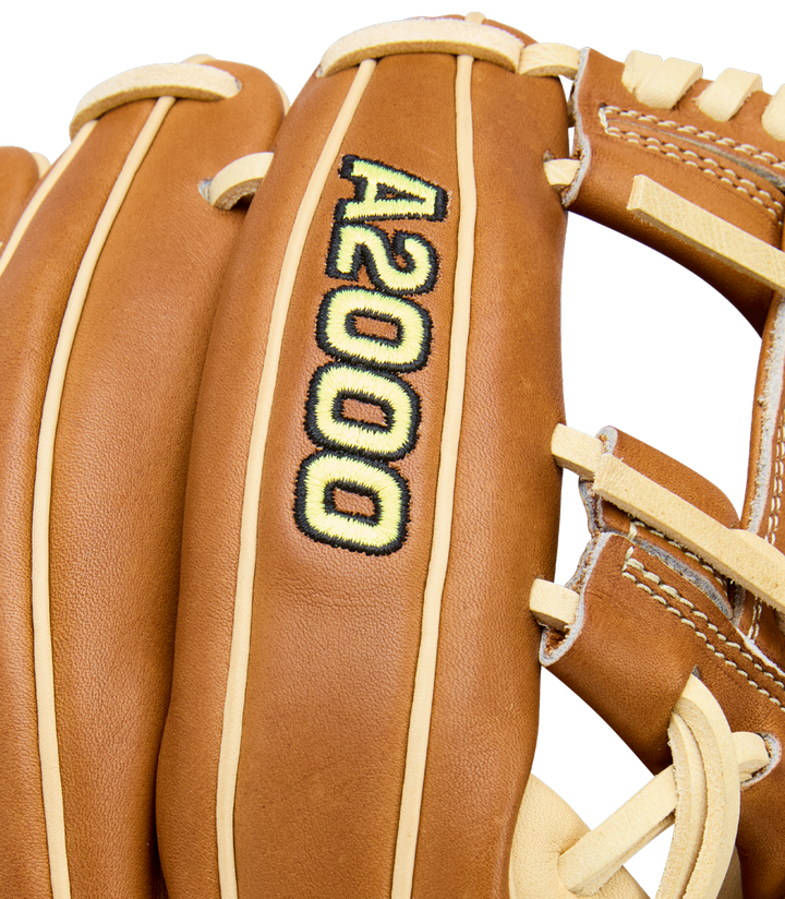 Close-up of a Wilson A2000 1975 11.75" baseball glove, made from Pro Stock Leather with tan laces and black/yellow A2000 embroidery on the finger.