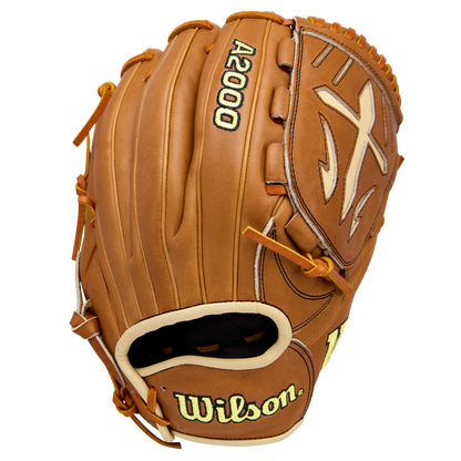 The Wilson A2000 B23 12" Baseball Glove, crafted from Pro Stock Leather, features brown leather with yellow stitching and laces, plus the Wilson logo and brand name on the outside, displayed against a white background.