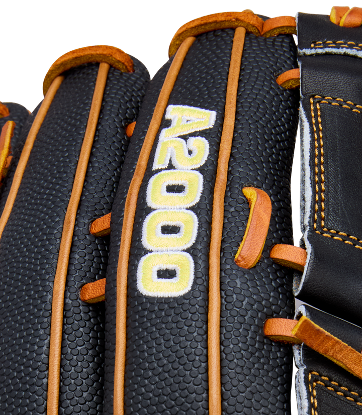 Close-up of the Wilson A2000 B125SS 12.5" baseball glove, featuring black leather with tan laces and stitching. "A2000" is embroidered in white and yellow on a finger, showcasing Wilson’s quality craftsmanship.